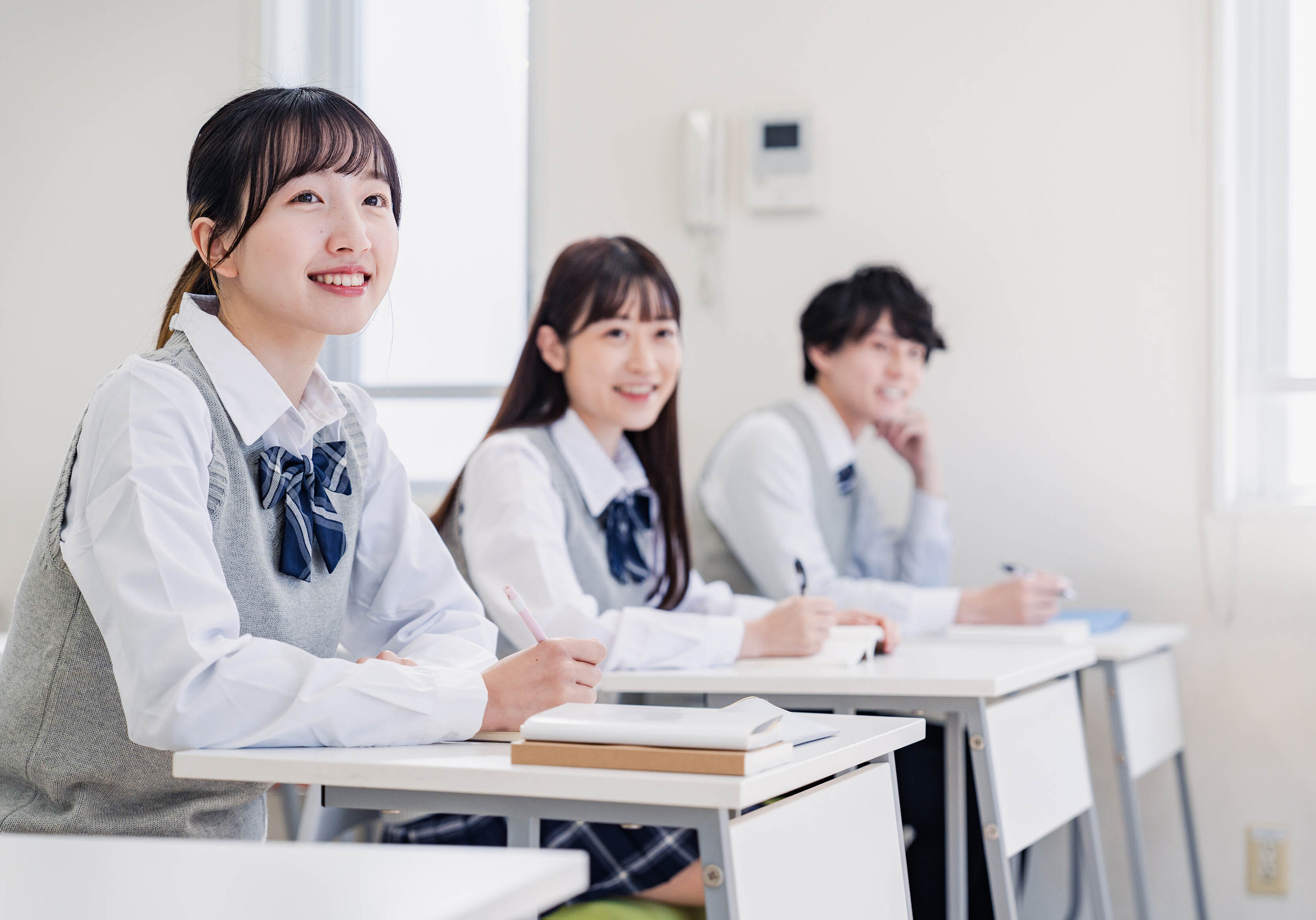 High school students enjoying class in a classroom